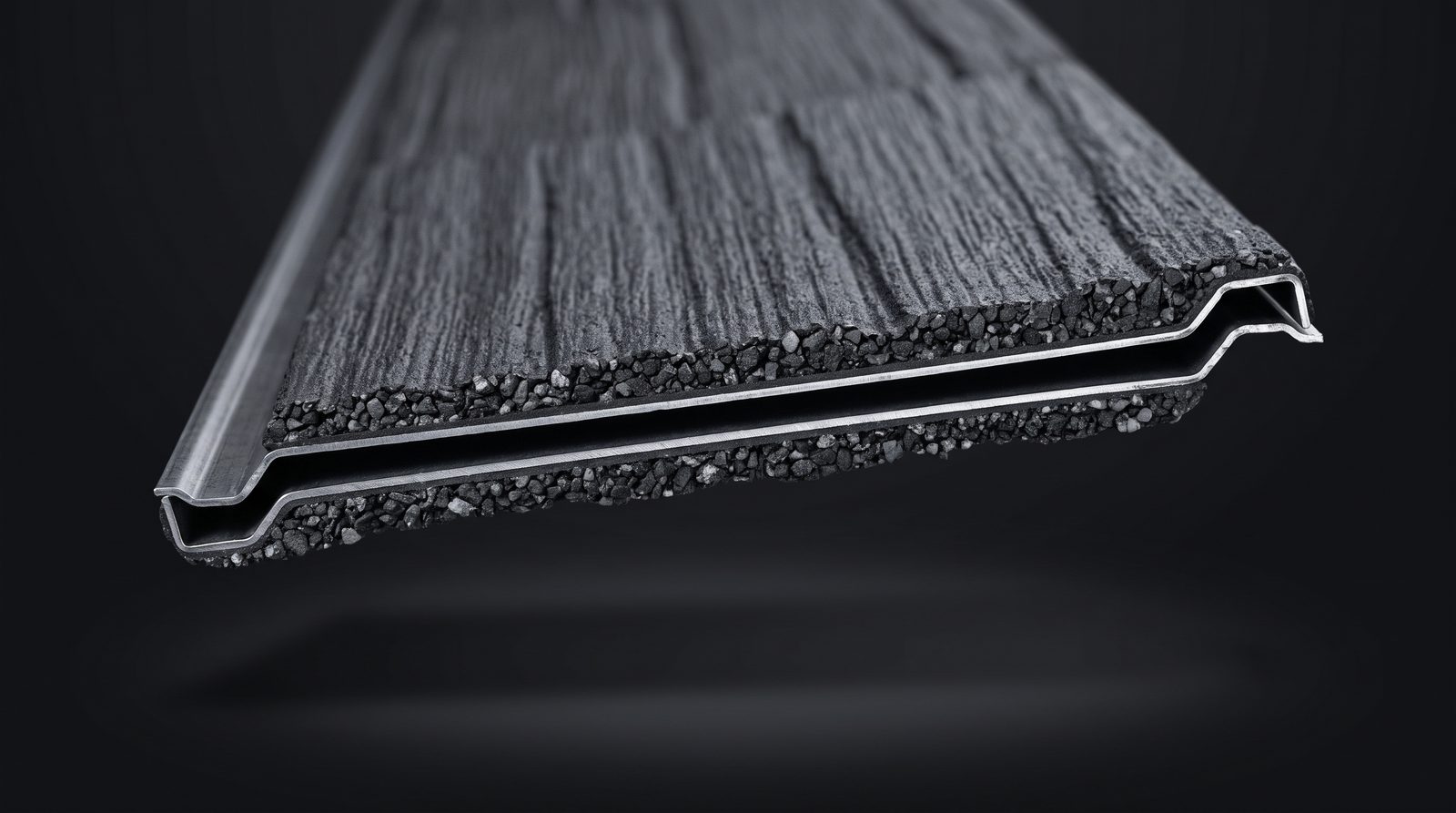 Cut-open view of a WeatherLok stone-coated steel panel showing the roll-formed steel core, the natural stone coat, the hidden screws, and the interlocking edges