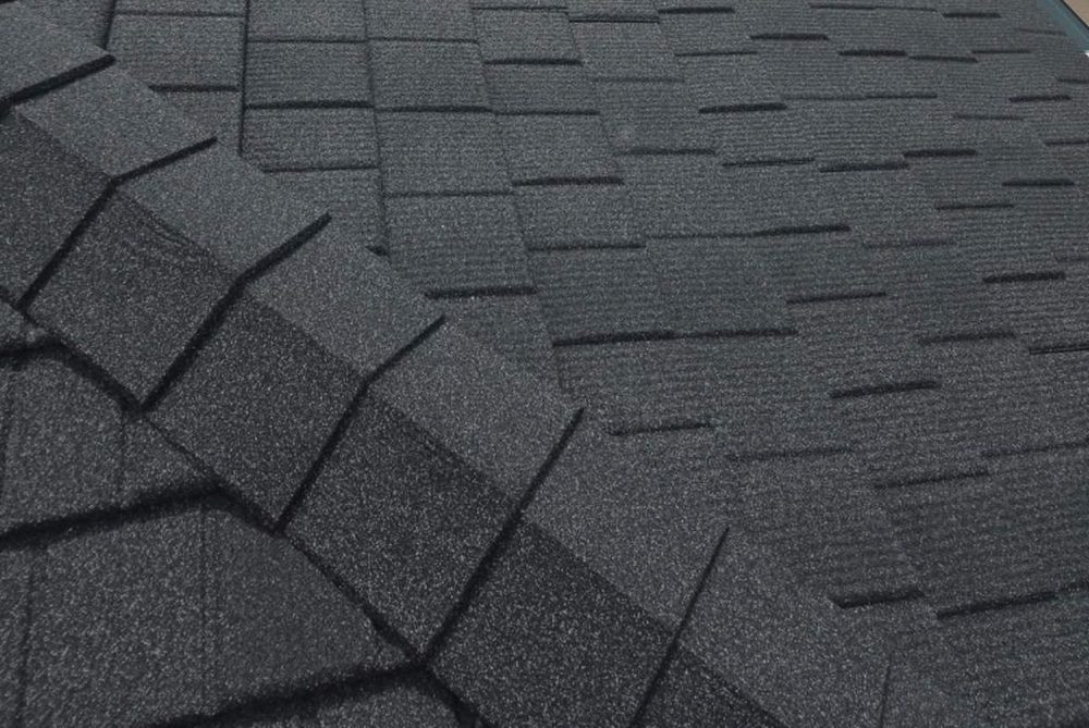 Close-up of WeatherLok stone-coated steel with a hand-split wood shake texture