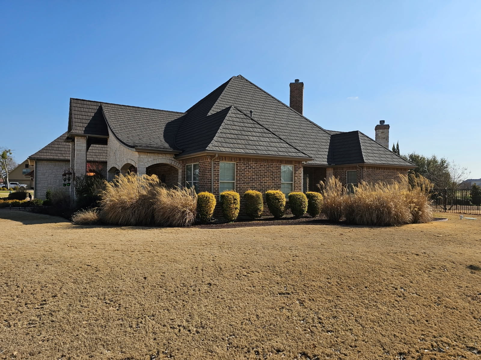 Estate home with a WeatherLok stone-coated steel shake roof