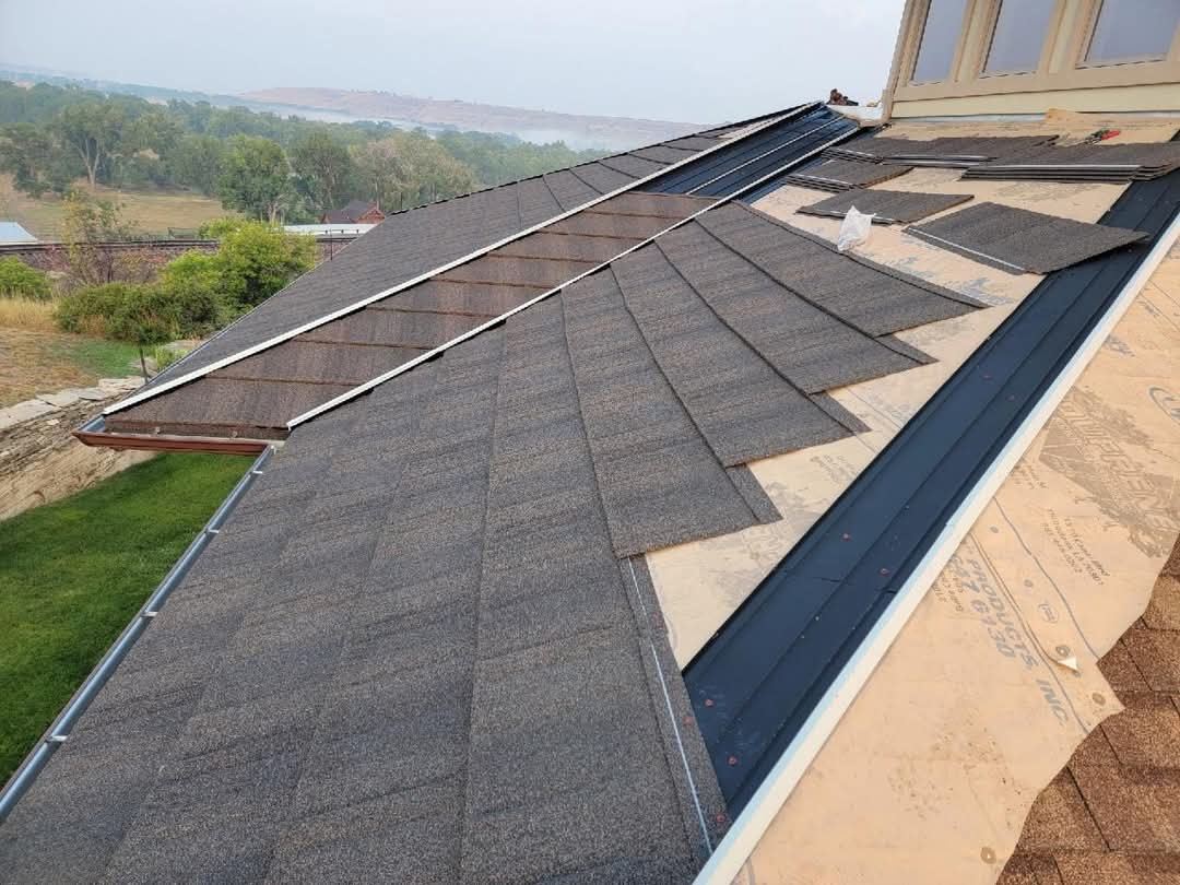 WeatherLok panels going down over the deck, showing the interlocking hidden-fastener courses