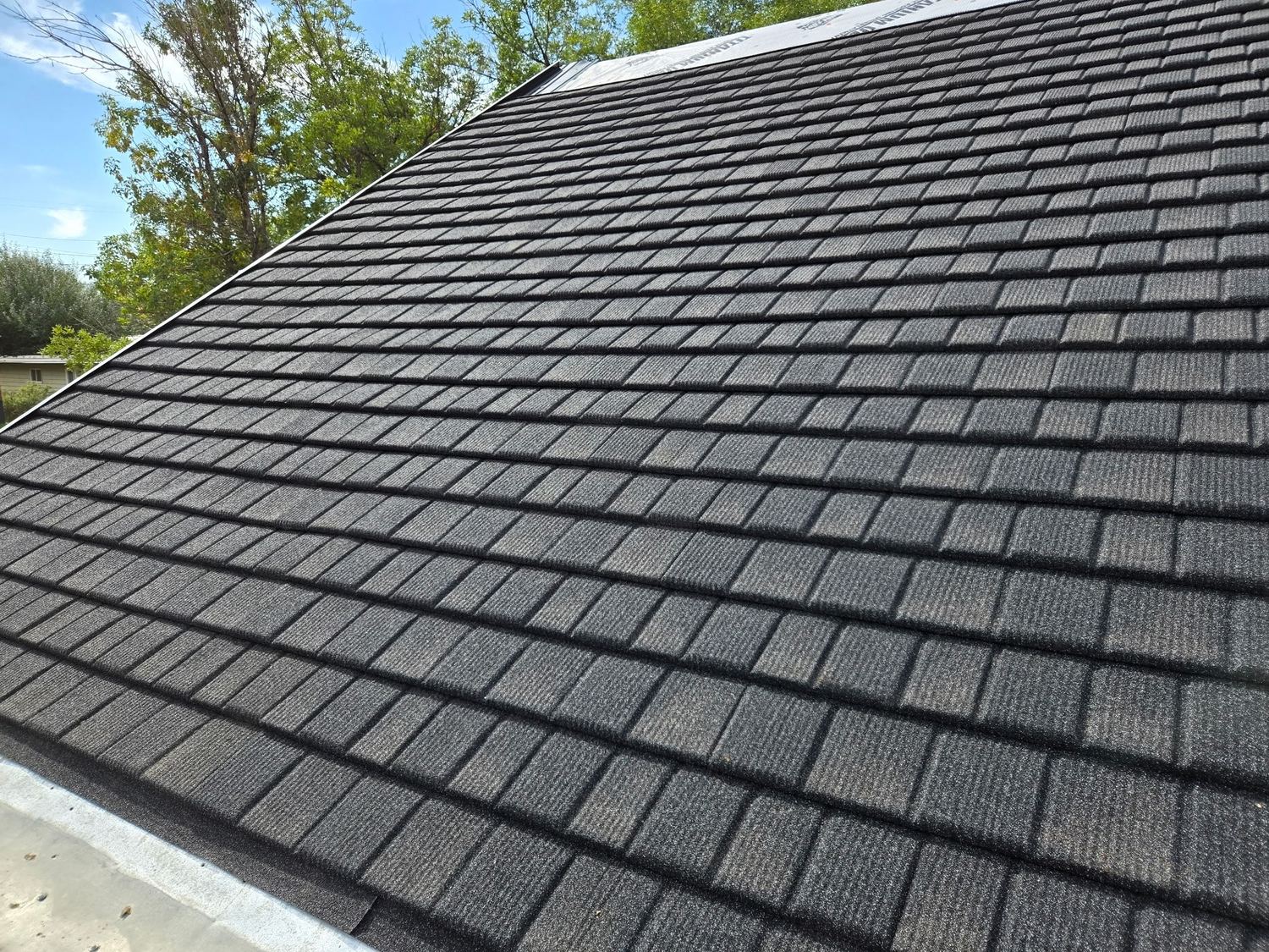 Close-up of the Charcoal Slate Shingle profile on a finished roof